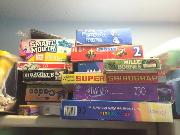 A stack of board games ready for a session